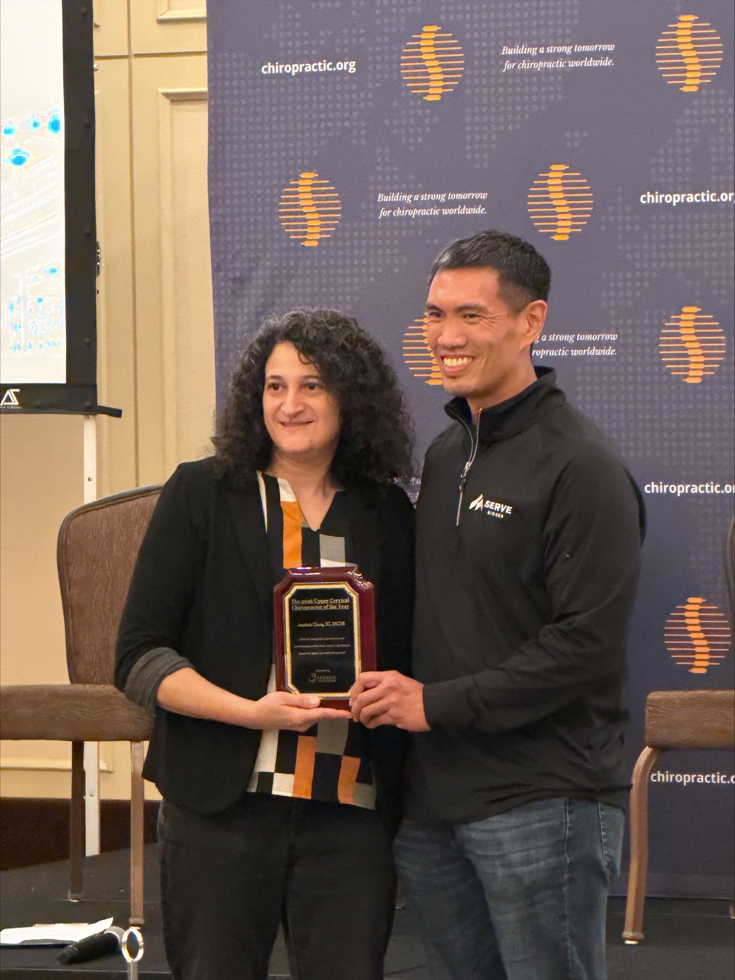 Dr. Jonathan Chung receiving the 2026 Upper Cervical Chiropractor of the Year recognition